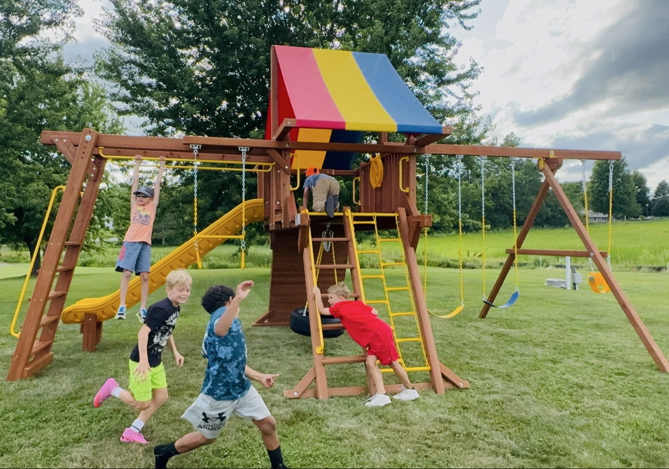 Five children playing together on the WCA playground